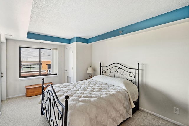 20 2nd St NE Unit P1008, Minneapolis, MN 55413 - carpeted bedroom with baseboards and a textured ceiling