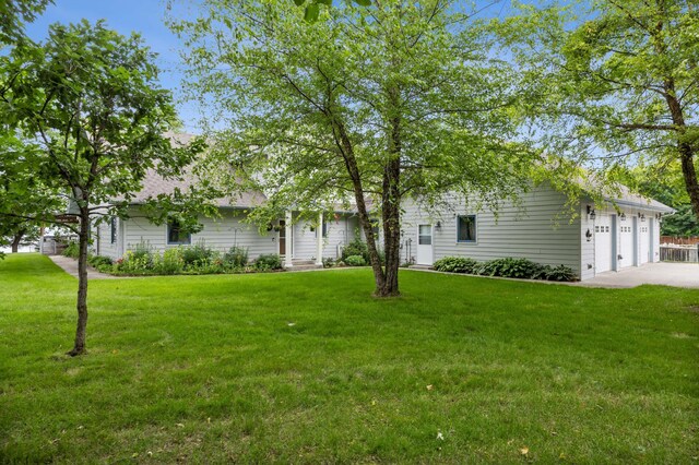 36773 Rose Lake Rd, Hobart Twp, MN 56544 - view of property hidden behind natural elements with a front yard and concrete driveway