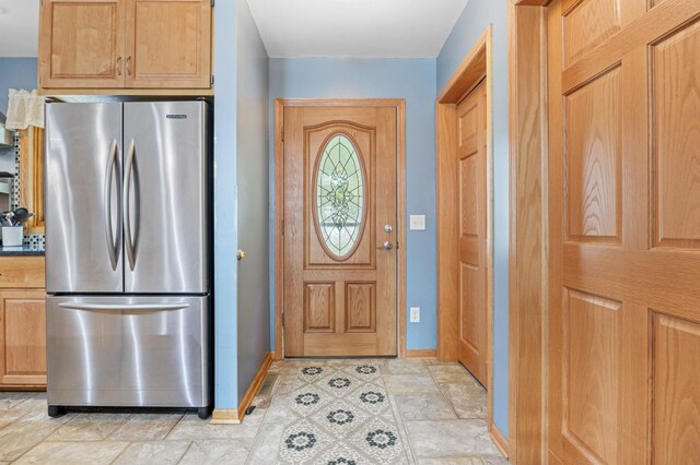 36773 Rose Lake Rd, Hobart Twp, MN 56544 - foyer featuring baseboards and light stone finish floors