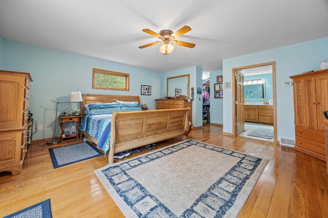 36773 Rose Lake Rd, Hobart Twp, MN 56544 - bedroom with light wood-style flooring, ensuite bathroom, and a ceiling fan
