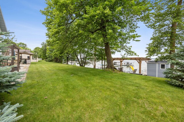 36773 Rose Lake Rd, Hobart Twp, MN 56544 - view of grassy yard with a pergola and a storage shed