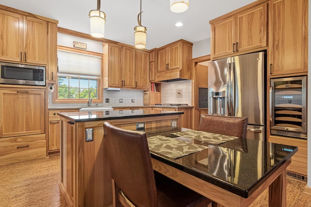 3599 210th St E, Vermillion Twp, MN 55024 - kitchen with appliances with stainless steel finishes, a kitchen island, beverage cooler, tasteful backsplash, and dark stone counters