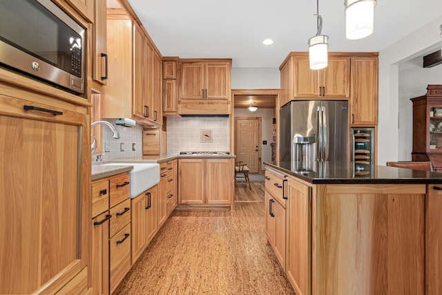 3599 210th St E, Vermillion Twp, MN 55024 - kitchen with stainless steel appliances, decorative backsplash, wine cooler, pendant lighting, and dark stone countertops