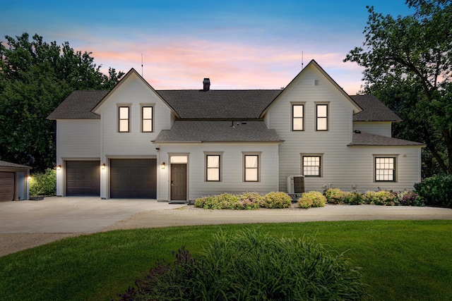 3599 210th St E, Vermillion Twp, MN 55024 - modern farmhouse style home featuring driveway, a garage, a lawn, a shingled roof, and a chimney