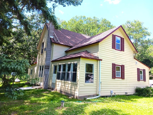 34251 190th Ave, Erhards Grove Twp, MN 56534 - view of home's exterior with roof with shingles and a yard