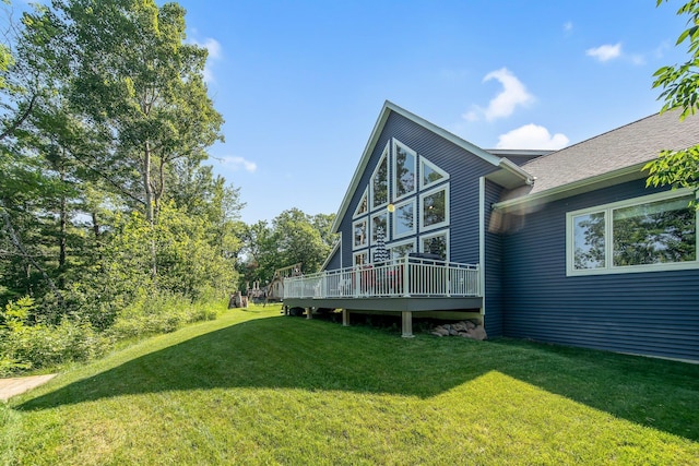 18465 Lake Ln, Chengwatana Twp, MN 55063 - view of side of property with a lawn, a deck, and roof with shingles