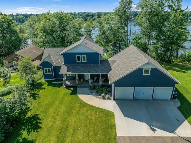18465 Lake Ln, Chengwatana Twp, MN 55063 - view of front facade featuring driveway, a front yard, a porch, and a shingled roof