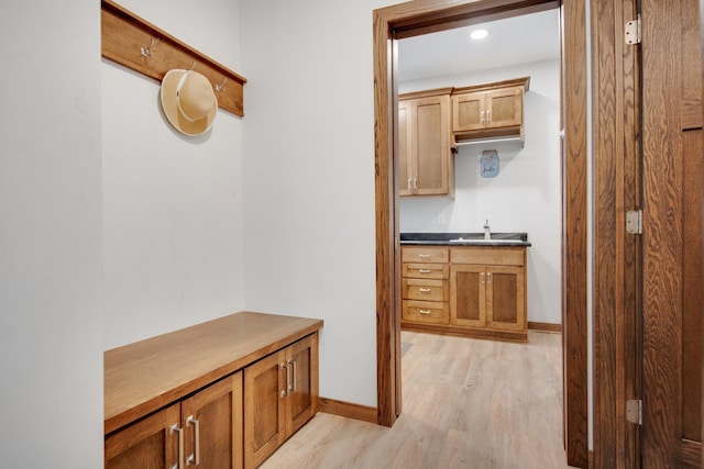 18465 Lake Ln, Chengwatana Twp, MN 55063 - hallway with light wood finished floors and a sink
