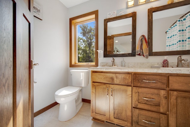 18465 Lake Ln, Chengwatana Twp, MN 55063 - bathroom featuring double vanity and toilet