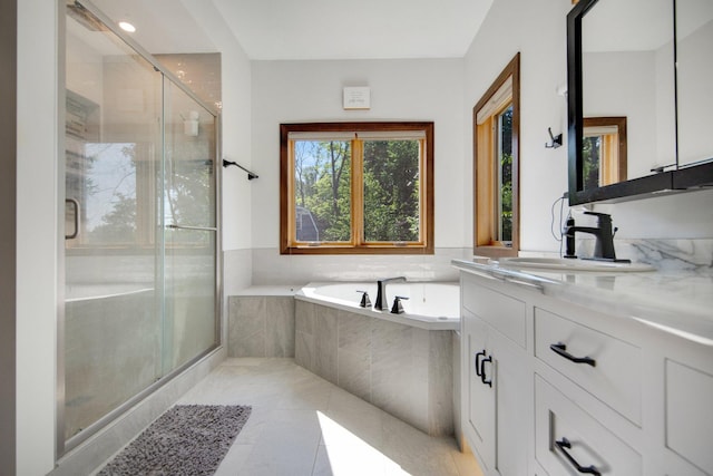 18465 Lake Ln, Chengwatana Twp, MN 55063 - full bath with vanity, a bath, a stall shower, and tile patterned floors