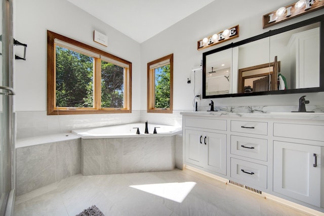 18465 Lake Ln, Chengwatana Twp, MN 55063 - full bathroom with a bath, double vanity, a shower with door, and tile patterned flooring