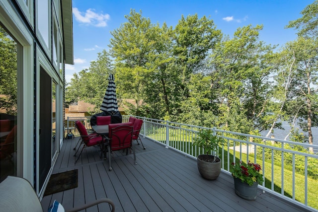 18465 Lake Ln, Chengwatana Twp, MN 55063 - wooden deck with outdoor dining area