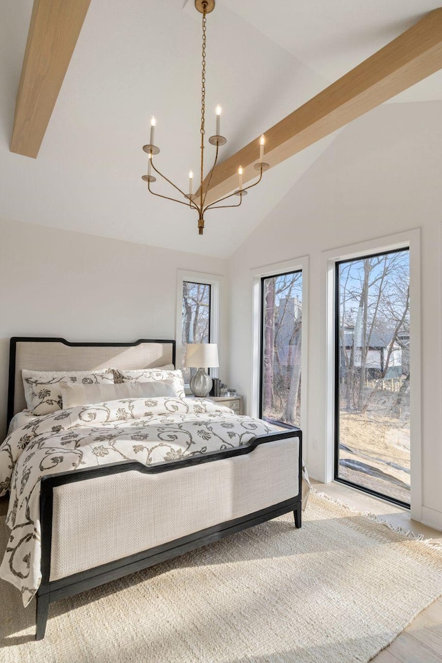 5250 Polaris Ln N, Plymouth, MN 55446 - bedroom featuring a chandelier, access to exterior, and high vaulted ceiling