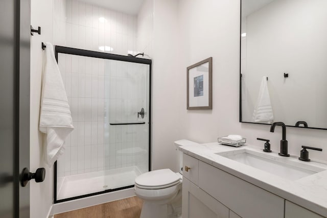5250 Polaris Ln N, Plymouth, MN 55446 - bathroom featuring vanity, a shower stall, and wood finished floors