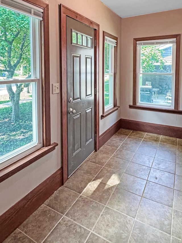 306 Jefferson St, Minneota, MN 56264 - entrance foyer featuring healthy amount of natural light and tile patterned floors