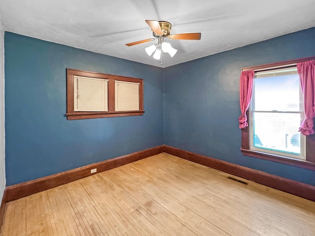 306 Jefferson St, Minneota, MN 56264 - unfurnished room featuring wood finished floors and a ceiling fan