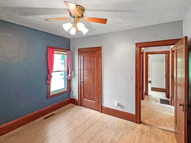 306 Jefferson St, Minneota, MN 56264 - unfurnished room featuring wood-type flooring and a ceiling fan
