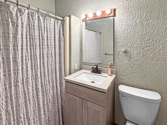 306 Jefferson St, Minneota, MN 56264 - bathroom with a textured wall, vanity, and a shower with shower curtain