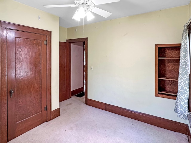 306 Jefferson St, Minneota, MN 56264 - unfurnished bedroom with light carpet and a ceiling fan