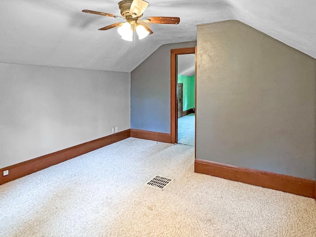 306 Jefferson St, Minneota, MN 56264 - additional living space featuring carpet floors, a ceiling fan, and vaulted ceiling