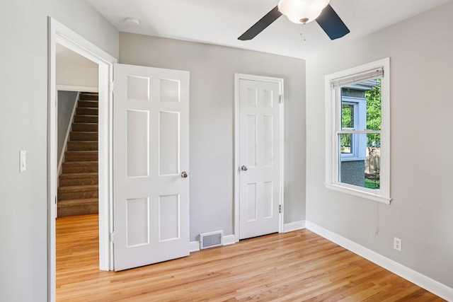 3212 Kentucky Ave S, Saint Louis Park, MN 55426 - unfurnished bedroom with light wood finished floors and ceiling fan