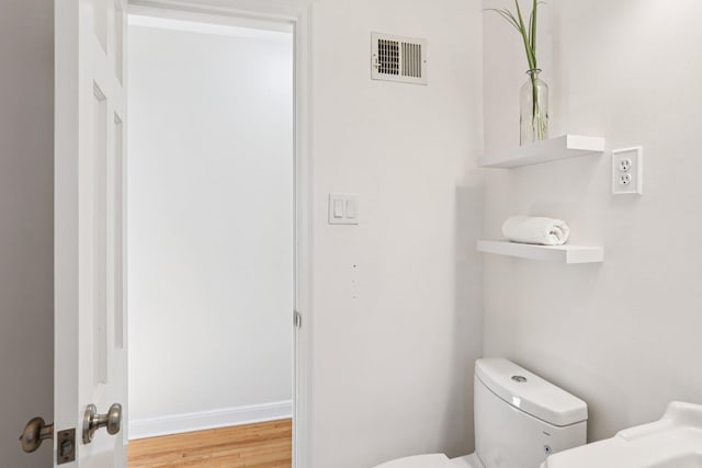 3212 Kentucky Ave S, Saint Louis Park, MN 55426 - half bathroom with toilet and wood finished floors