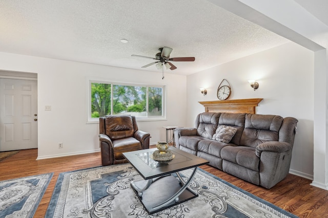2715 90th Ln NE, Blaine, MN 55449 - living area featuring ceiling fan, wood finished floors, and a textured ceiling