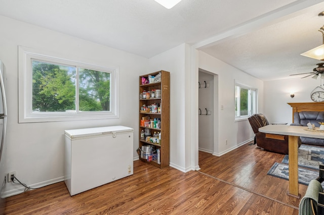 2715 90th Ln NE, Blaine, MN 55449 - office featuring wood finished floors, a ceiling fan, and a textured ceiling