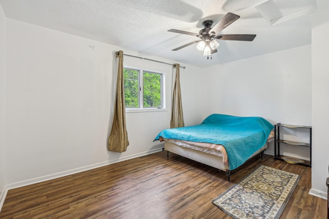 2715 90th Ln NE, Blaine, MN 55449 - bedroom with wood finished floors, ceiling fan, and a textured ceiling