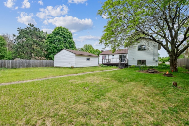 2715 90th Ln NE, Blaine, MN 55449 - view of yard with an outdoor fire pit and a wooden deck