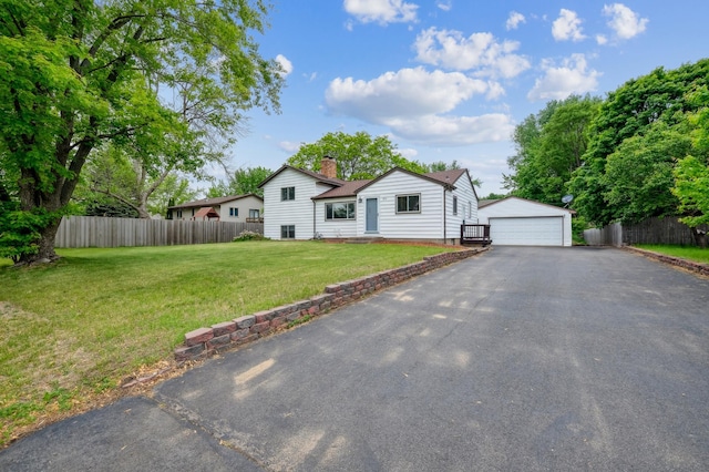 2715 90th Ln NE, Blaine, MN 55449 - view of front of house with an outdoor structure, a chimney, and a garage