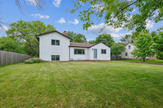 2715 90th Ln NE, Blaine, MN 55449 - rear view of property with a chimney
