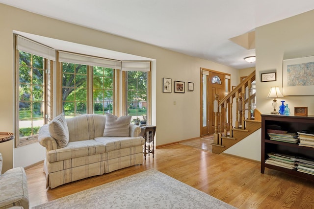 10910 38th Ave N, Plymouth, MN 55441 - living room featuring wood finished floors and stairs