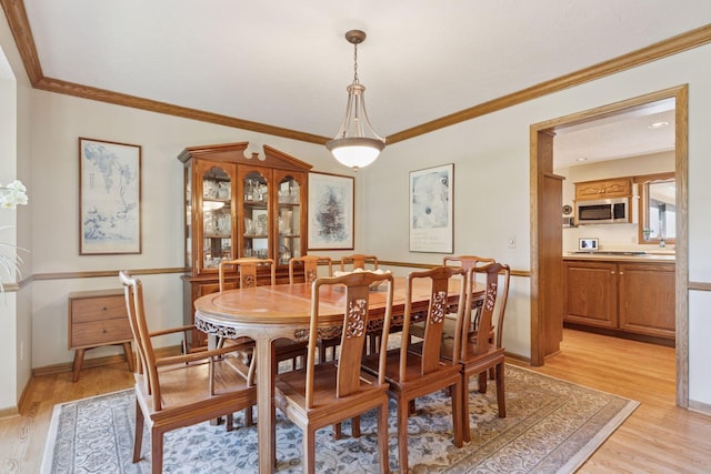 10910 38th Ave N, Plymouth, MN 55441 - dining space with light wood-type flooring and crown molding