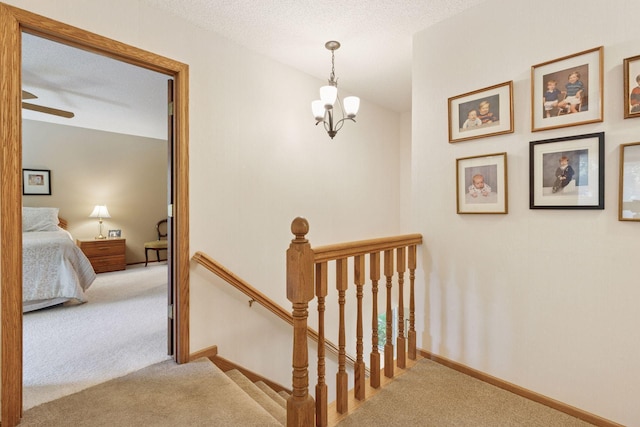 10910 38th Ave N, Plymouth, MN 55441 - staircase featuring carpet floors, a chandelier, and ceiling fan