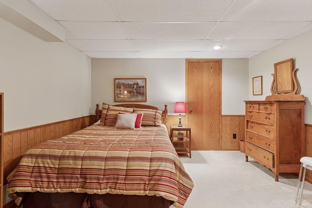 10910 38th Ave N, Plymouth, MN 55441 - carpeted bedroom with wood walls, wainscoting, a paneled ceiling, and recessed lighting