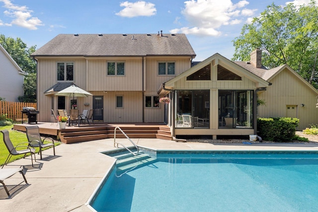 10910 38th Ave N, Plymouth, MN 55441 - swimming pool with a sunroom, a wooden deck, grilling area, and a patio area