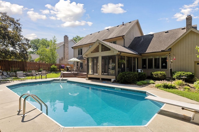 10910 38th Ave N, Plymouth, MN 55441 - view of swimming pool with a sunroom, a diving board, a patio area, and a deck