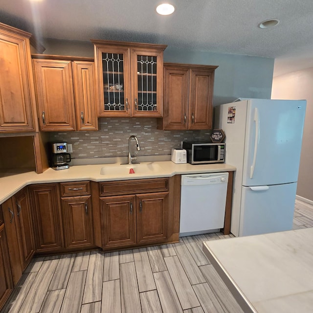 17544 366th St, Bagley, MN 56621 - kitchen featuring white appliances, light countertops, light wood finished floors, tasteful backsplash, and recessed lighting