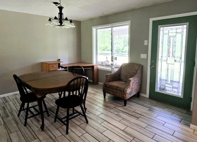 17544 366th St, Bagley, MN 56621 - dining area with light wood finished floors and a chandelier