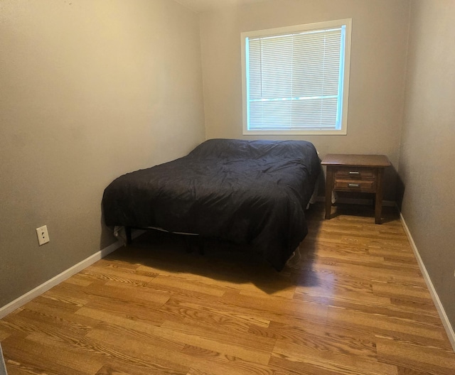 17544 366th St, Bagley, MN 56621 - bedroom featuring wood finished floors and baseboards