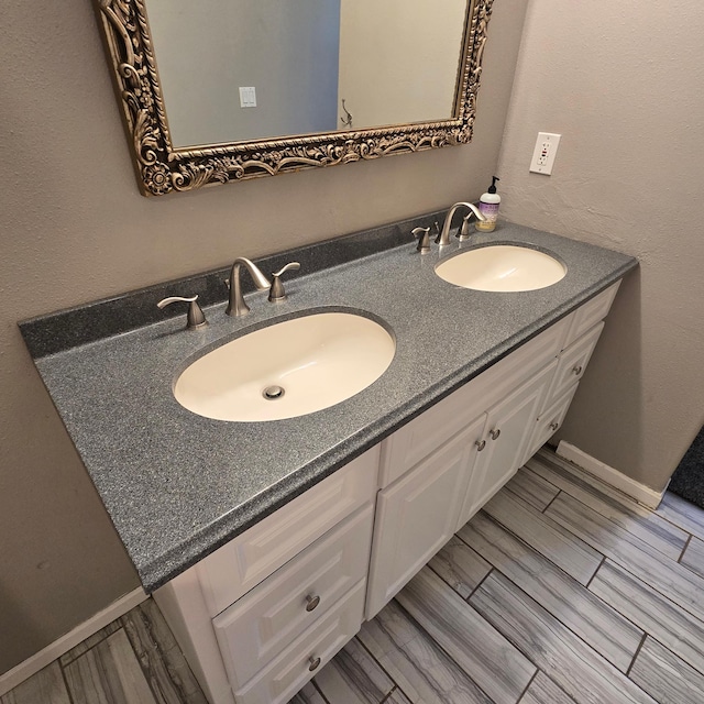 17544 366th St, Bagley, MN 56621 - bathroom featuring double vanity and wood tiled floors