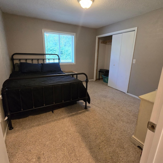 17544 366th St, Bagley, MN 56621 - bedroom featuring carpet flooring, a closet, and a textured ceiling