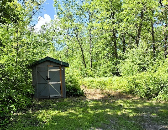 17544 366th St, Bagley, MN 56621 - view of shed featuring a wooded view