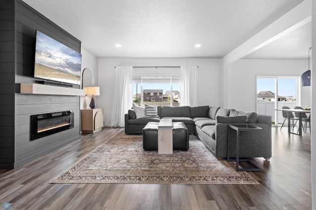 1030 Albert Dr W, West Fargo, ND 58078 - living area featuring healthy amount of natural light, a fireplace, wood finished floors, and recessed lighting