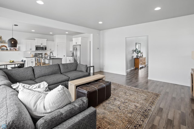1030 Albert Dr W, West Fargo, ND 58078 - living area featuring dark wood-style floors and recessed lighting