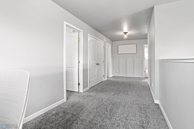 1030 Albert Dr W, West Fargo, ND 58078 - hallway with carpet floors and baseboards