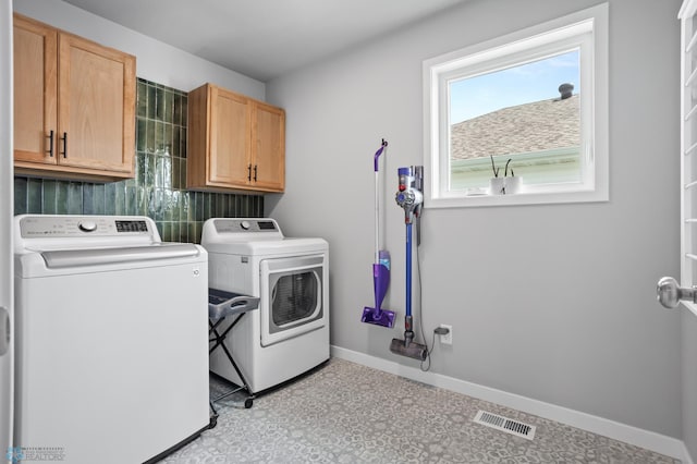 1030 Albert Dr W, West Fargo, ND 58078 - laundry area featuring cabinet space, washing machine and clothes dryer, and tile patterned floors