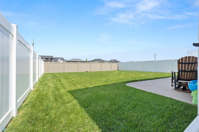 1030 Albert Dr W, West Fargo, ND 58078 - fenced backyard with a patio