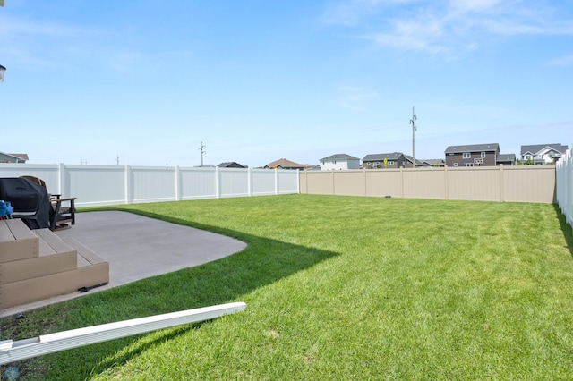 1030 Albert Dr W, West Fargo, ND 58078 - fenced backyard with a patio